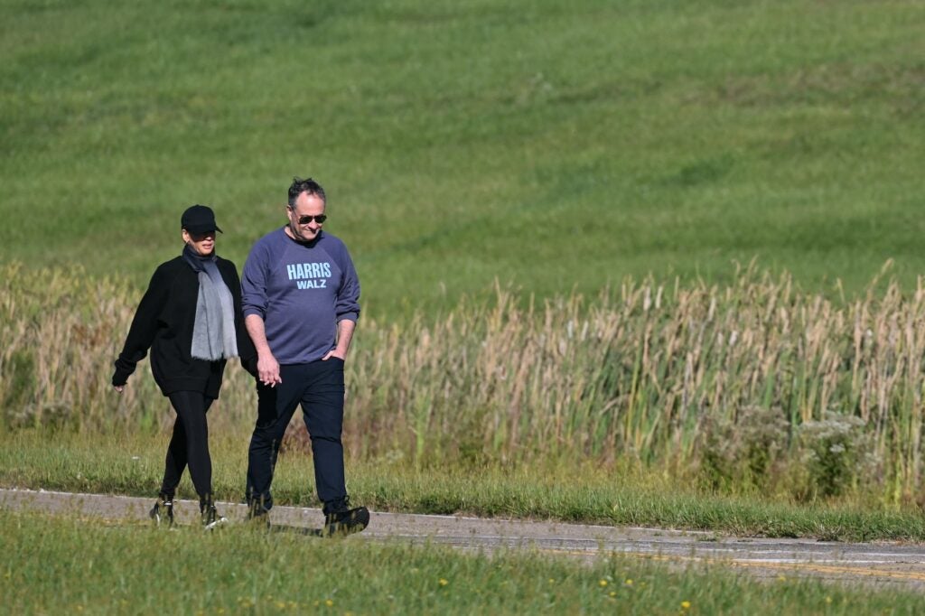 Kamala Harris walking with her husband Doug Emhoff