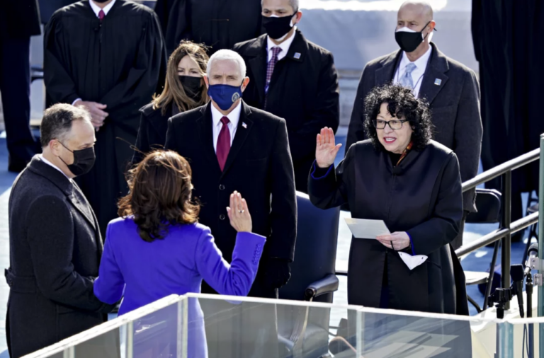 Supreme Court Justice Sonia Sotomayor (right) administers the oath of office to incoming Vice President Kamala Harris in front of the U.S. Capitol on Jan. 20, 2021, as outgoing Vice President Mike Pence (wearing blue mask) watches