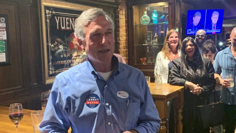 Outgoing Delaware Gov. John Carney speaks to supporters at Catherine Rooney's Irish bar after winning the race for Wilmington mayor. (Sarah Mueller/WHYY)