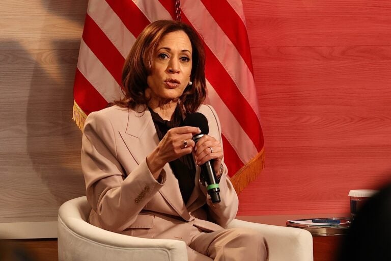 Kamala Harris sits and speaks