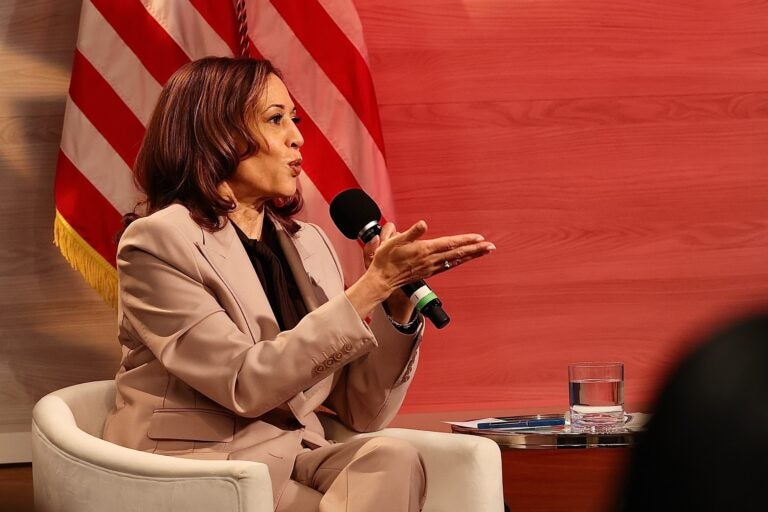 Kamala Harris sits and speaks