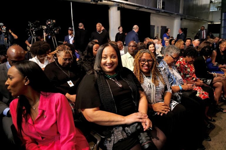 Sarah Glover smiles while sitting in the crowd