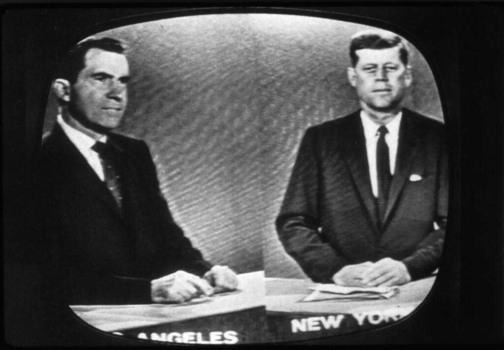 A black and white photo of Richard Nixon and John F. Kennedy