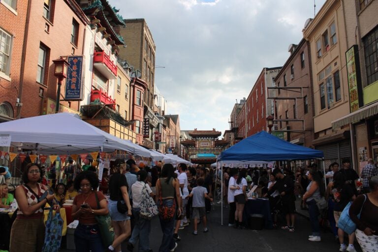 Attendees walk through the street