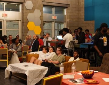 The crowd of students in Neumann University's Flynn Hall swells ahead of the U.S. presidential debate. (Kenny Cooper/WHYY)