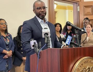 Reverend Charles Boyer speaks behind a podium