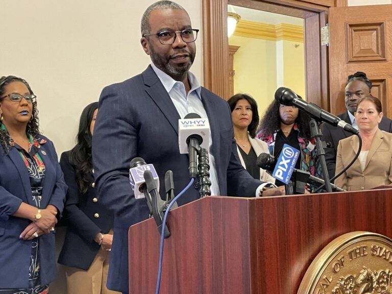 Reverend Charles Boyer speaks behind a podium