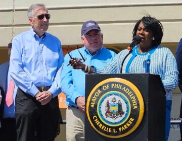 Mayor Parker speaks behind a podium