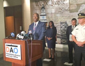 Robert Listenbee speaks behind a podium