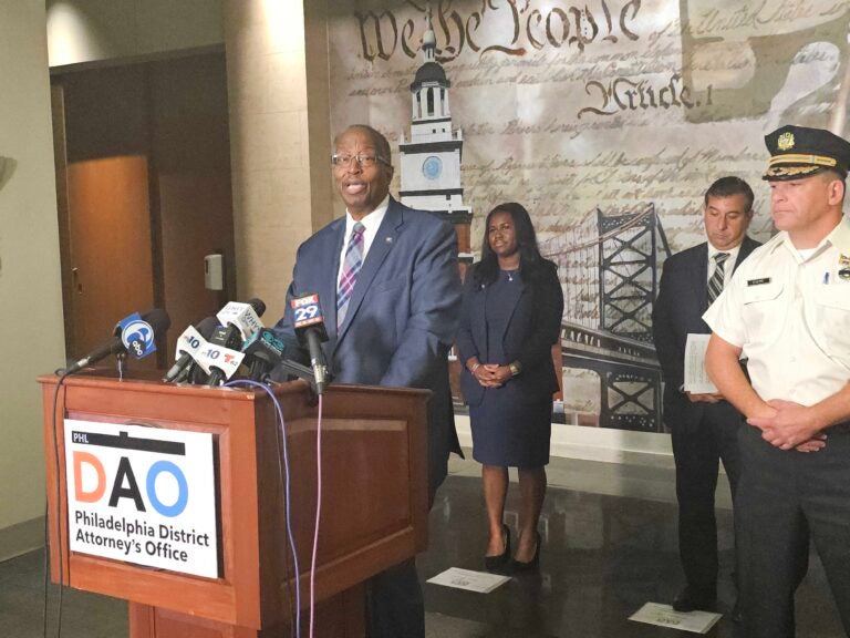 Robert Listenbee speaks behind a podium