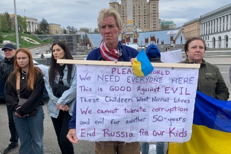 Ryan Wesley Routh holds up a banner during a rally in central Kyiv, Ukraine