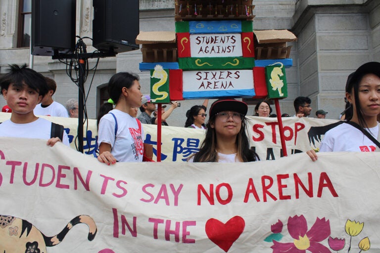 People march against 76er Place in Philadelphia's Chinatown neighborhood