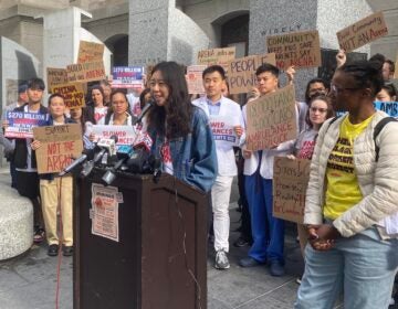 Jenny Zhang speaking at a podium