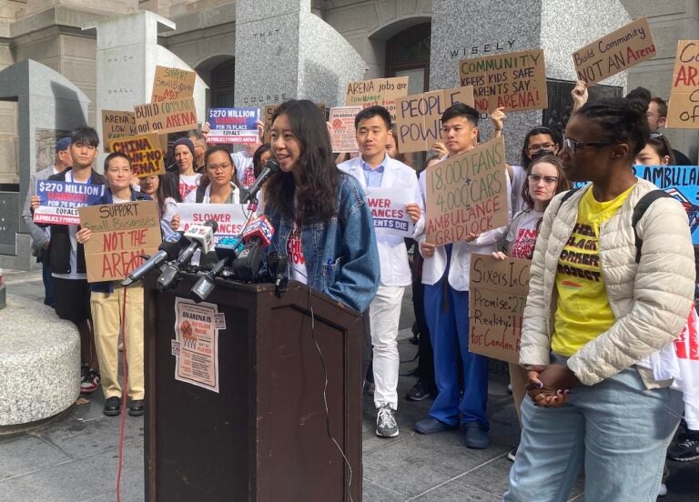 Jenny Zhang speaking at a podium