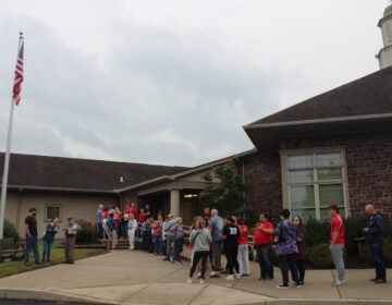 People line up outside a school board meeting in Souderton