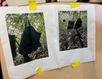 Photos that show an AK-47 rifle, a backpack and a Go-Pro camera on a fence outside Trump International Golf Club