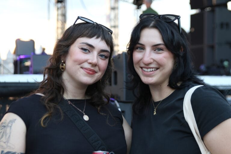 Alyssa Gilpin (left) and Sarah Wozunk (right) got to see one of their favorite artists, Blondshell, up close at the River Stage over the weekend. (Cory Sharber/WHYY)