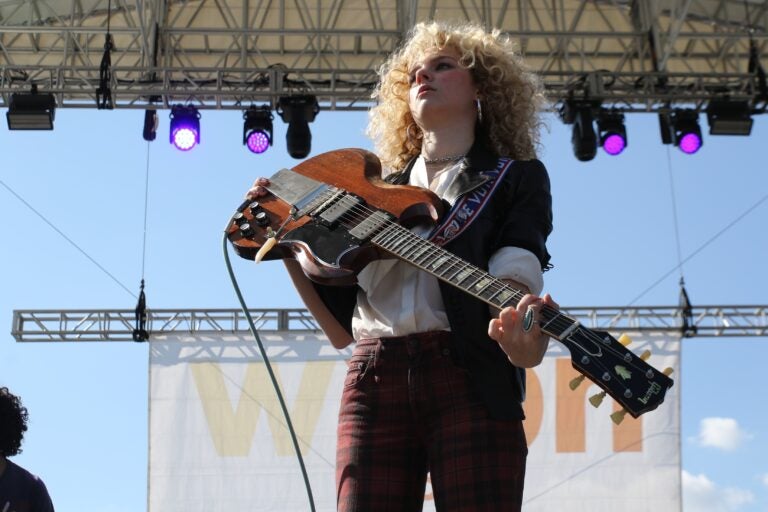 Grace Bowers playing guitar