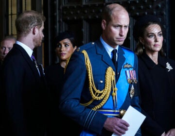 Britain's Prince William, second right, Kate, Princess of Wales, right, Prince Harry, left, and Meghan, Duchess of Sussex, second left, leave after they paid their respects to Queen Elizabeth II lying in state at Westminster Hall, in London, Wednesday, Sept. 14, 2022. (AP Photo/Emilio Morenatti)