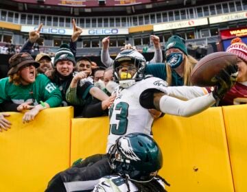 Philadelphia Eagles safety Rodney McLeod (23) celebrates with fans after making an interception against Washington Football Team quarterback Taylor Heinicke (4) in the final minute the second half of an NFL football game, Sunday, Jan. 2, 2022, in Landover, Md. Philadelphia won 20-16. (AP Photo/Alex Brandon)