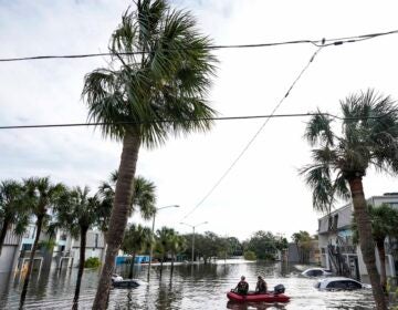 A water rescue boat floats in floods left after Hurricane Milton in Florida