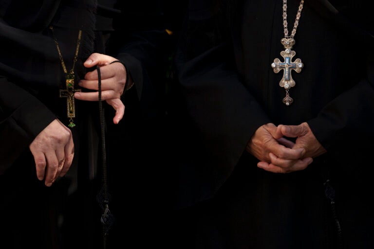 Nuns attend the procession of Saint Dimitrie Bassarabov, the patron saint of the Romanian capital, in Bucharest, Romania, Thursday, Oct. 24, 2024. (AP Photo/Andreea Alexandru)