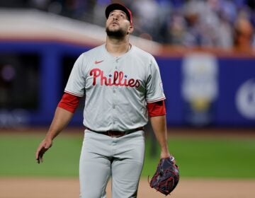 Carlos Estévez walks off the field and looks up