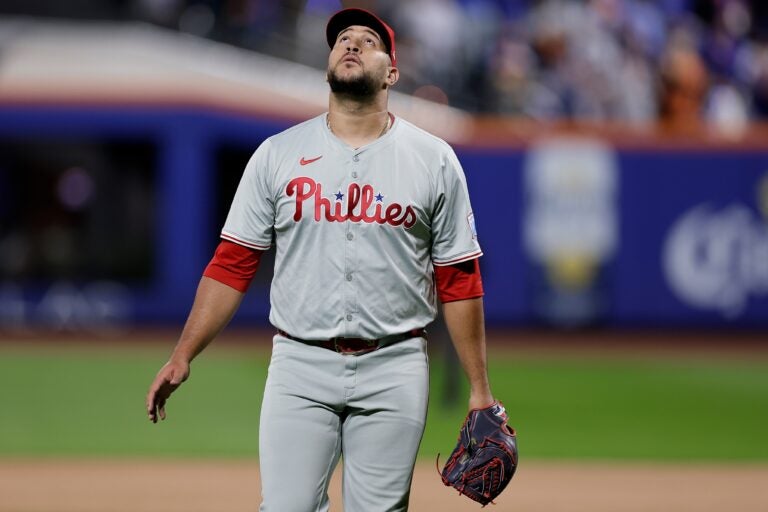 Carlos Estévez walks off the field and looks up