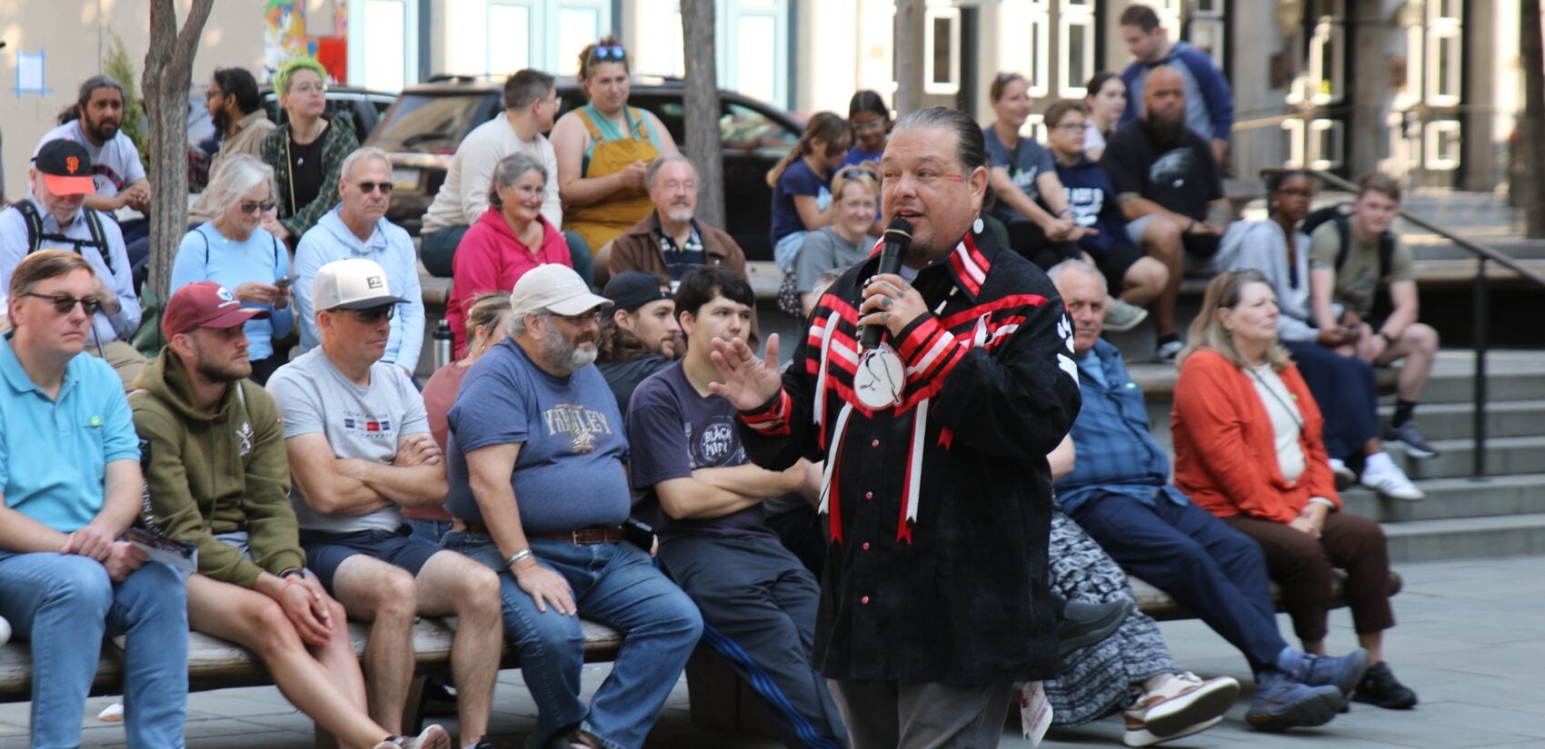 a person speaks to a crowd