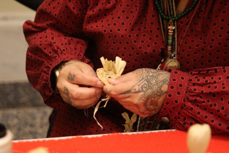 hands weaving cloth