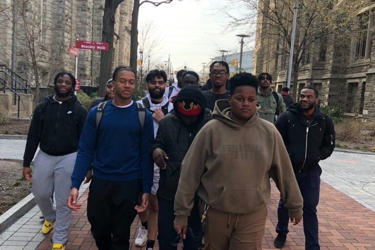 students walk through Temple