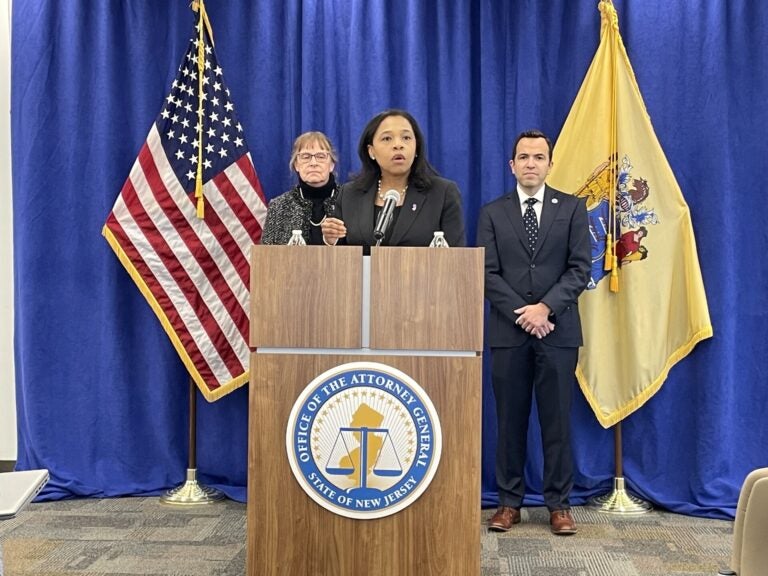 Tahesha Way speaks behind a podium