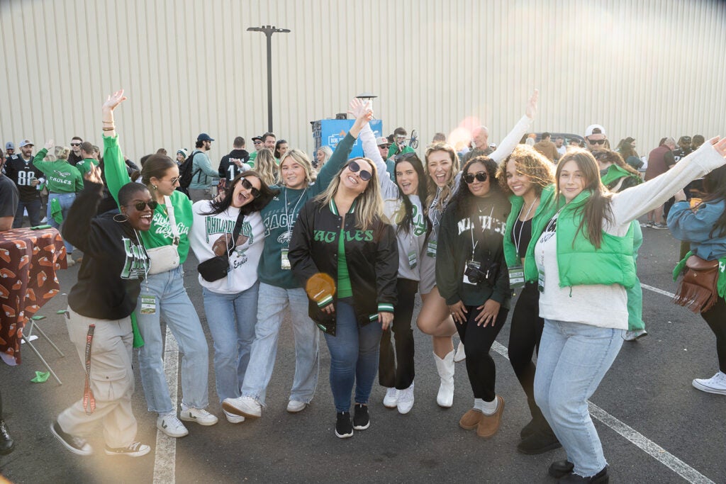 a crowd smiles for a picture