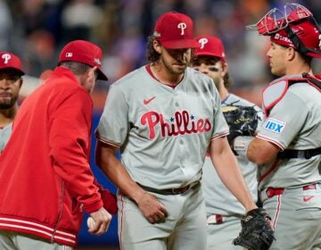 Aaron Nola being taken off the mound