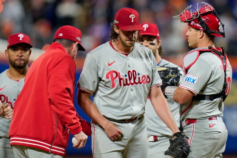 Aaron Nola being taken off the mound