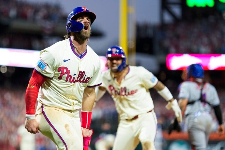 Philadelphia Phillies' Bryce Harper, left, and Nick Castellanos