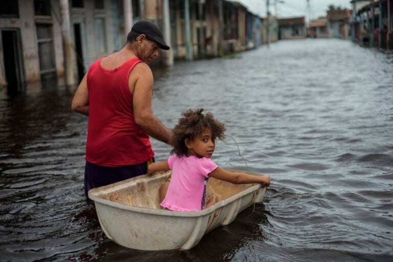 Jesus Hernandez guides granddaughter