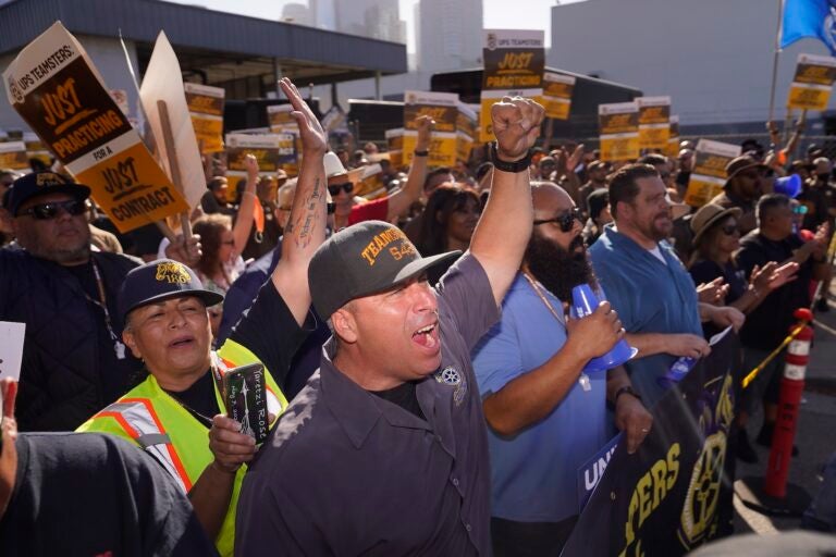 Teamsters and workers hold a rally