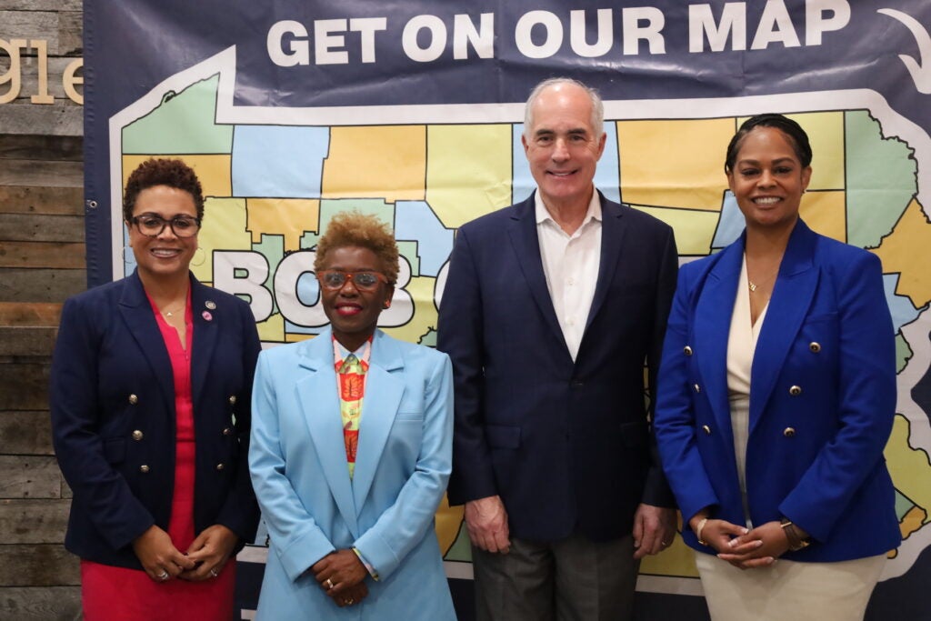 Gina Curry, Dr. Janine Darby, Bob Casey, and Morgan Cephas posing for a photo