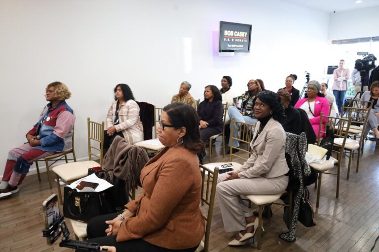 Audience members listen to the discussion