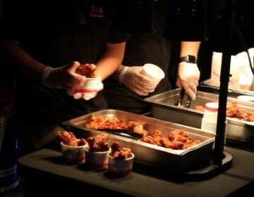 BonChon chicken being placed into cups