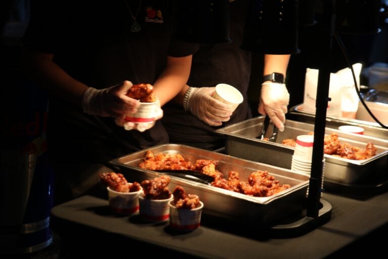 BonChon chicken being placed into cups