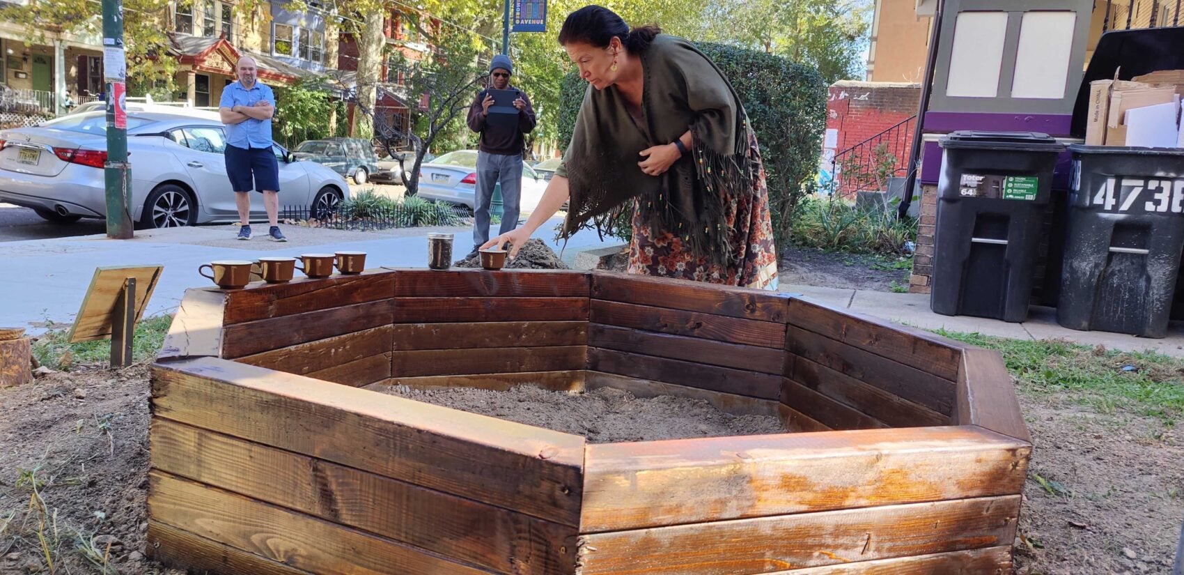 Chief Bluejay adds dirt to the raised bed