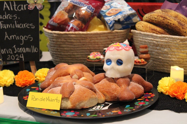 Pan de muerto is a sweet bread traditionally made and eaten during Día de los Muertos celebrations in Mexico. (Emily Neil/WHYY)