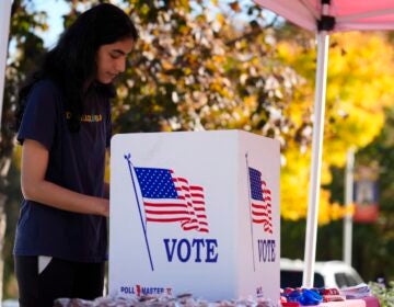 Shreya Srinivasan fills out her mail-in ballot at a Montgomery County voter services mobile location in King of Prussia, Pa., Tuesday, Oct. 22, 2024