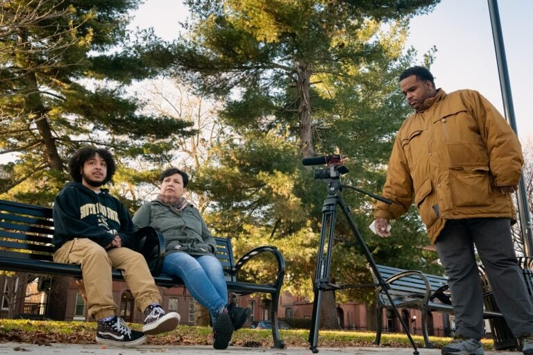 Ethan, his mom and Steve outside