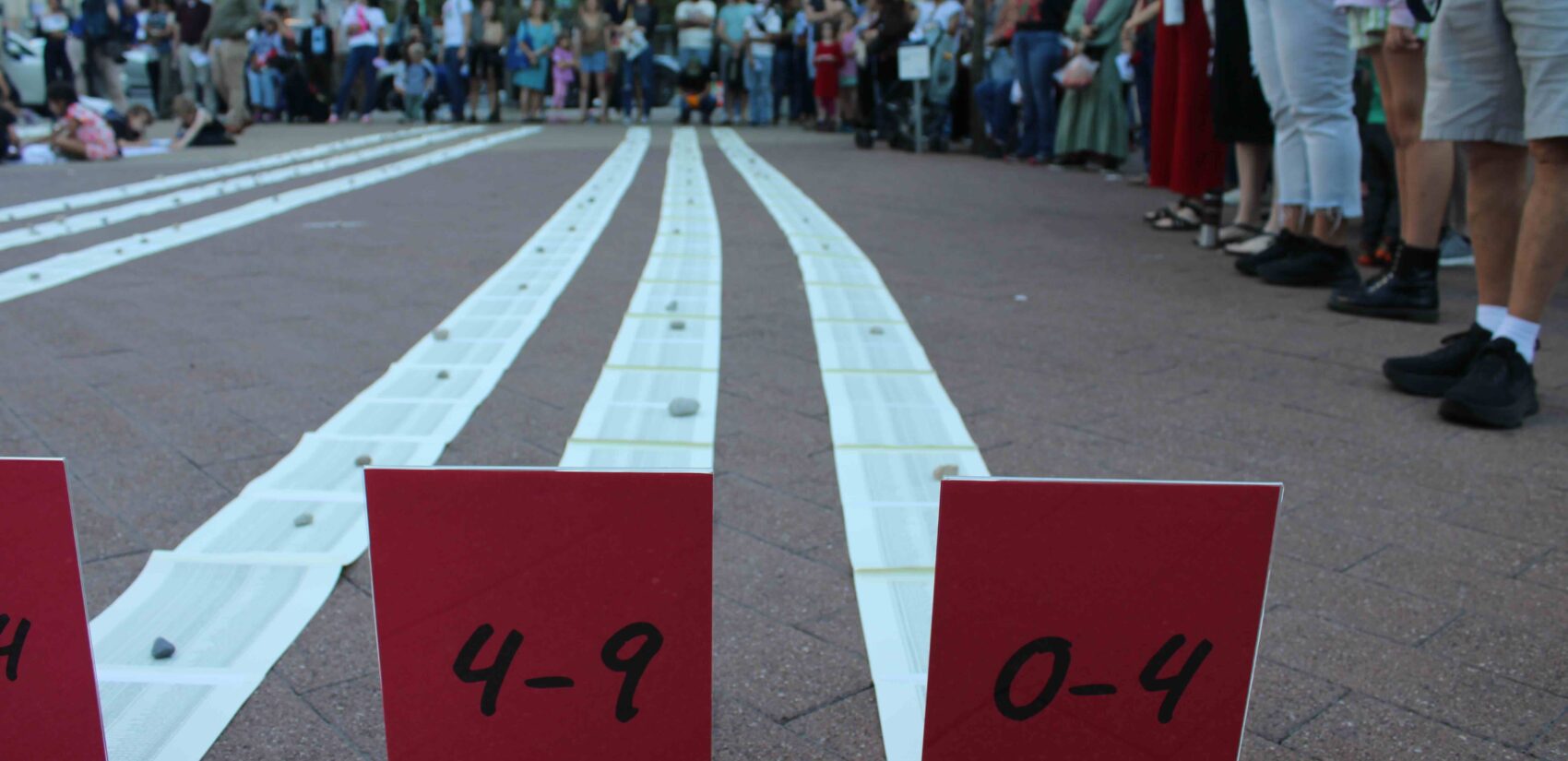 Placards showed the ages of Palestinians who were killed in the war. (Emily Neil/WHYY)