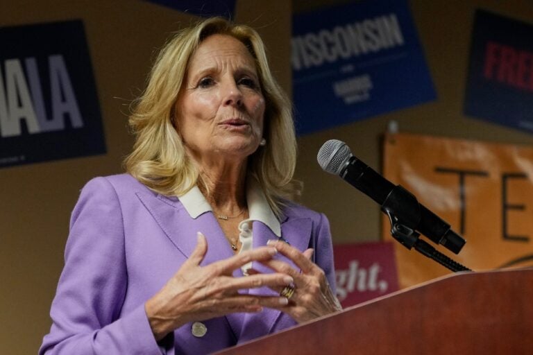 Jill Biden speaks behind a podium