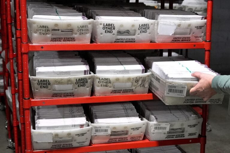 mail ballots on a shelf