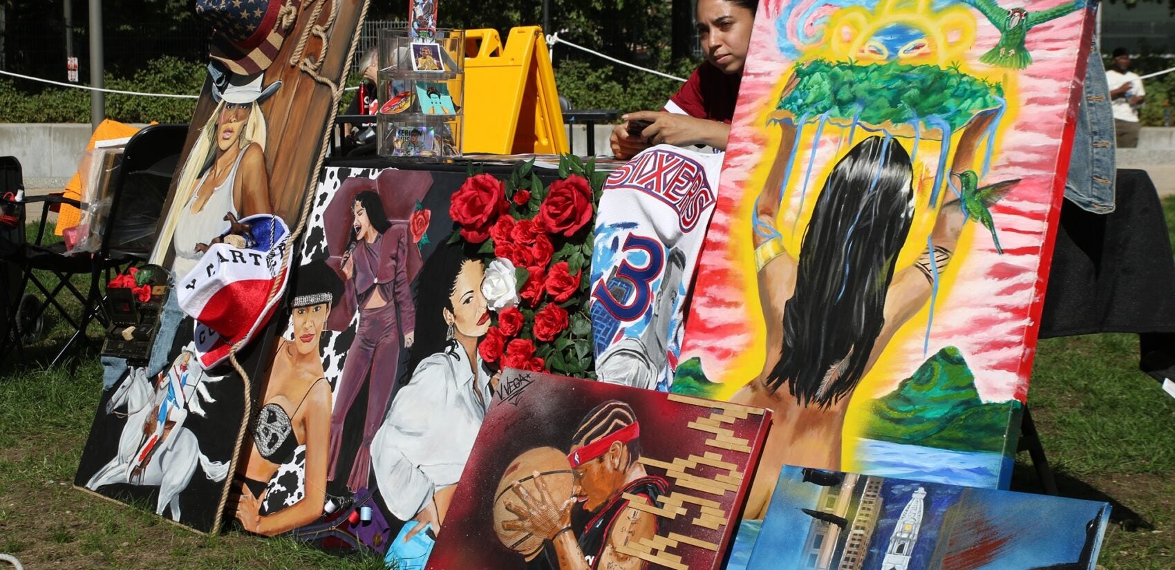 an artist selling multiple painting